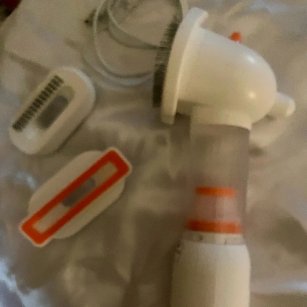 NEW, in box, (never used) a pet (dog or cat) vacuum. Get rid of that pesky hair!